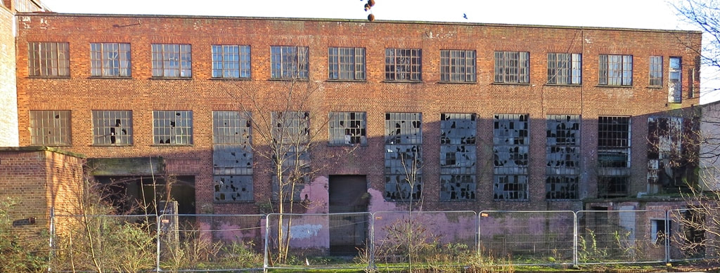 Derelict factory building with broken windows of the Chisenhale Works in Bow taken on Paul Talling's walk along the Hertford Union Canal and Roman Road