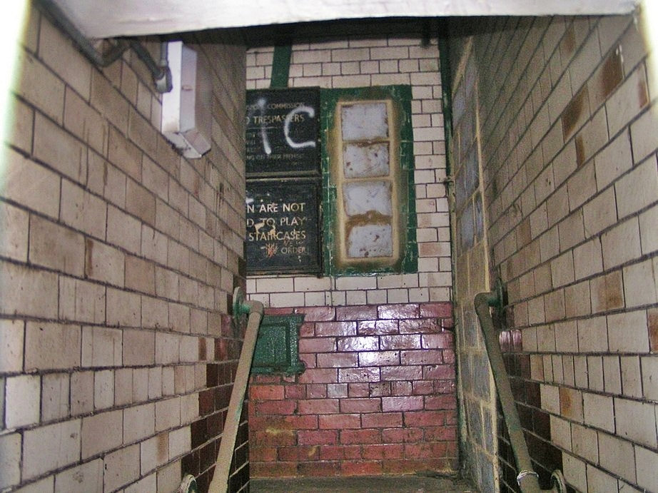 run-down stairwell of Victorian flats behind Kings Cross Station in North London
