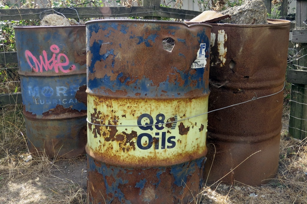 Q8 Oils. Abandoned oil drums in Dartford