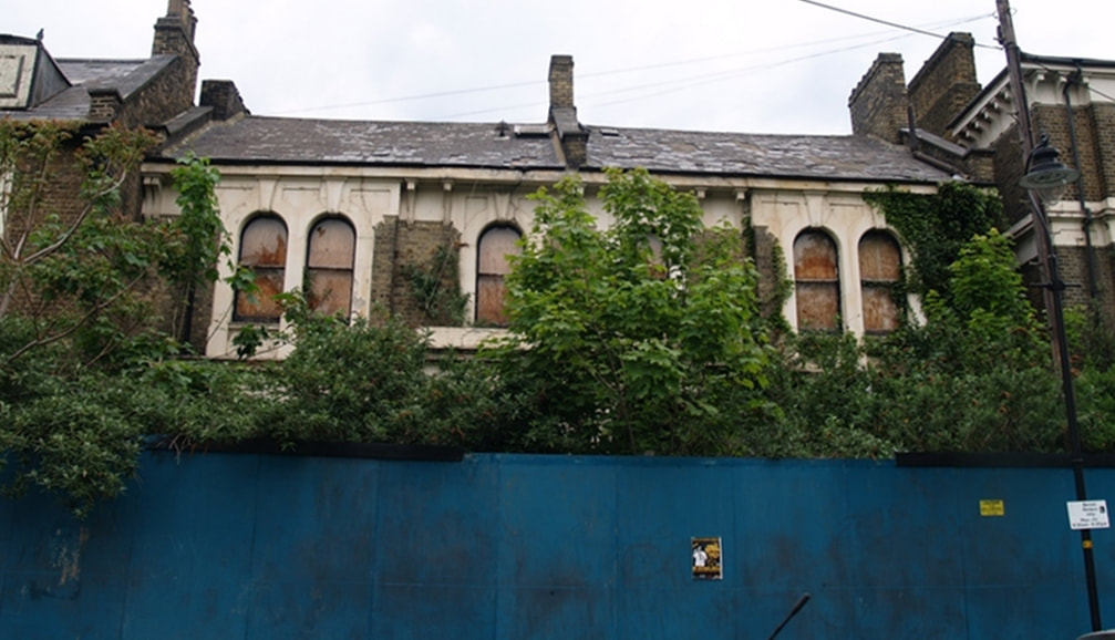 Derelict overgrown and neglected houses in South London