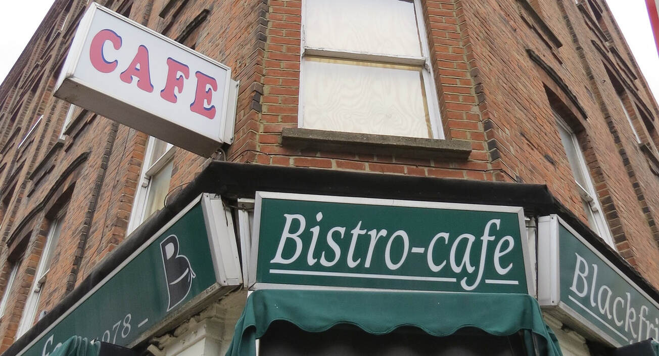 Boarded up cafe and redundant bistro signs on the Blackfriars Road in London
