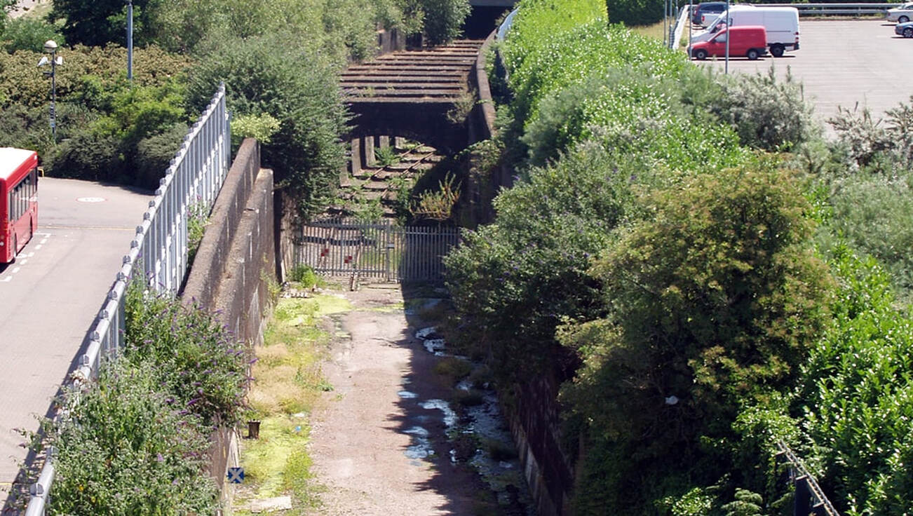 The overgrown entrance to Connaught Tunnel viewed from Custom House