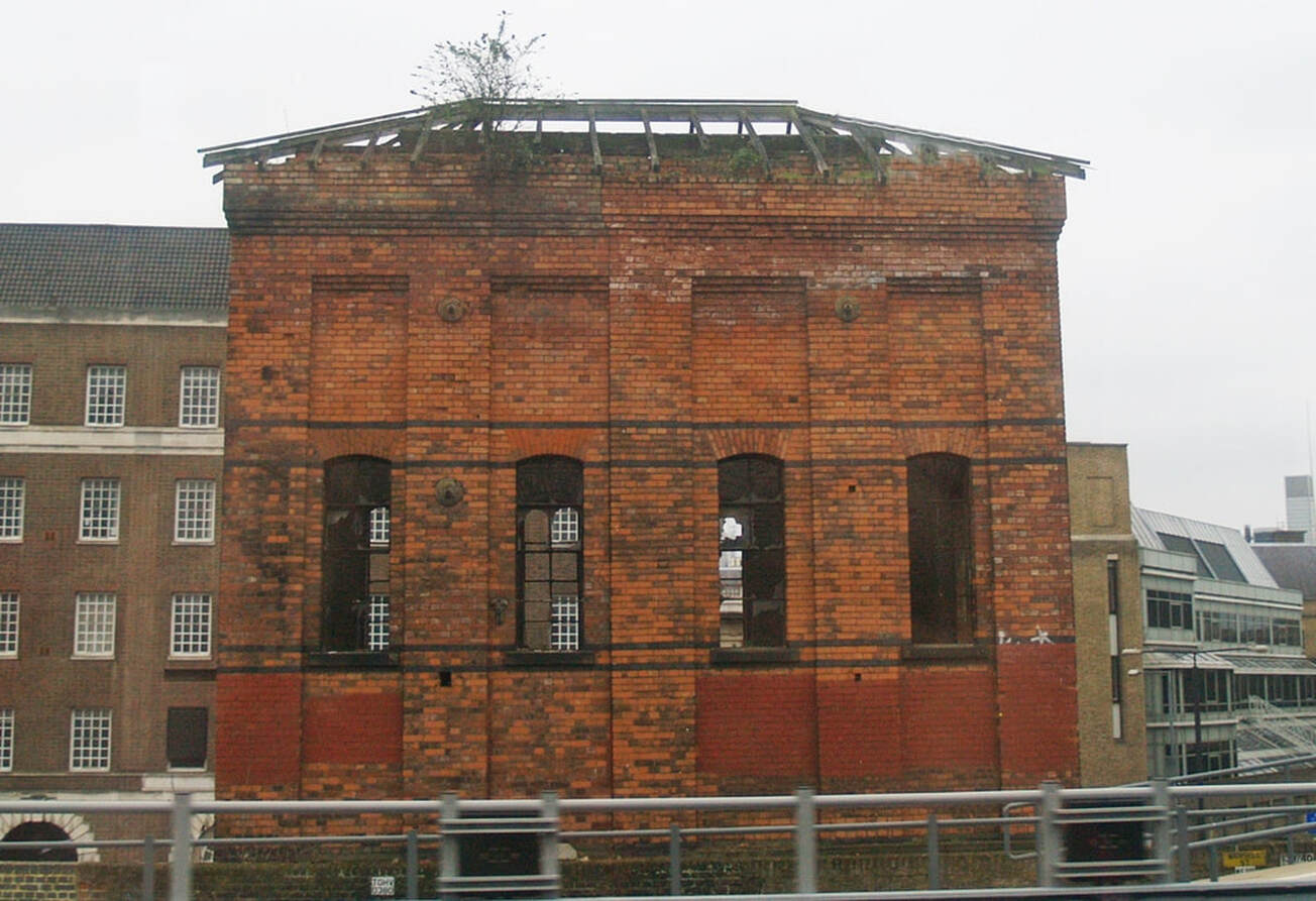 Derelict hydraulic accumulator tower in Royal Mint Street at Minories prior to demolition