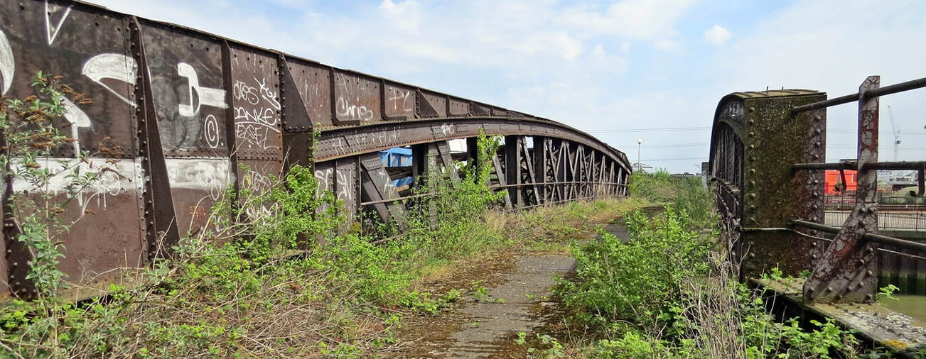 Abandoned railway bridge across the River Lea in ​Canning Town, London, E16