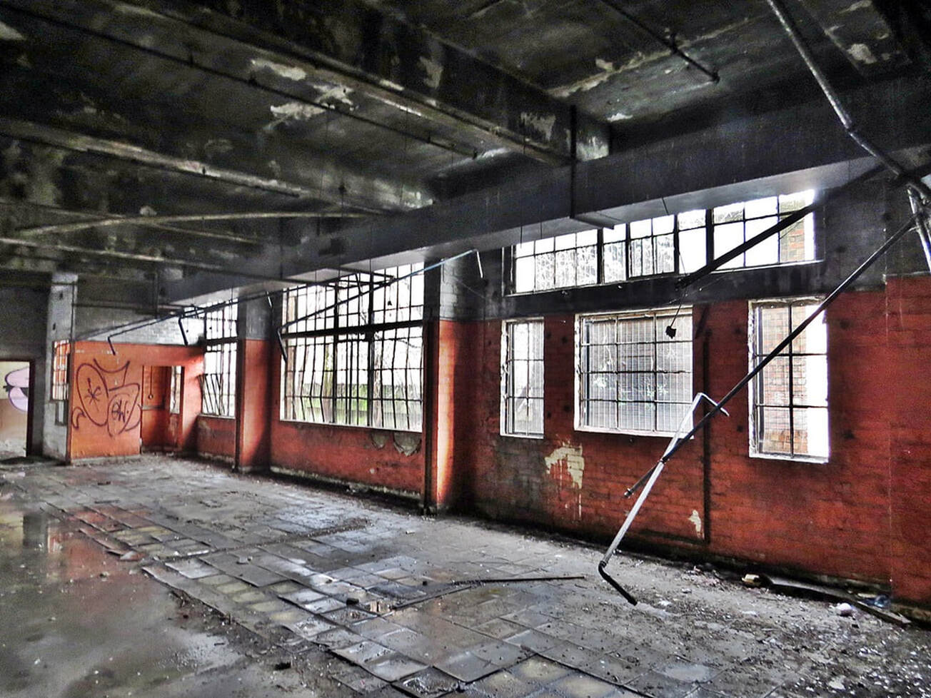 picture of red and grey interior of brick warehouse in East London