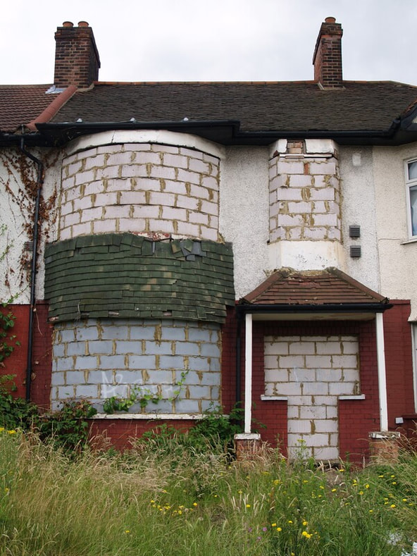 Derelict abandoned properties on the North Circular Road, Palmers Green have now been restored by Notting Hill Housing Association