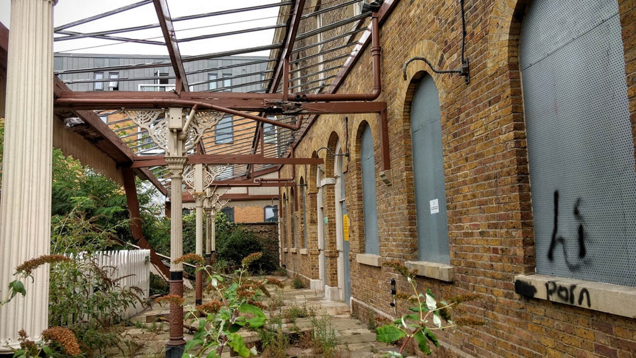 Dilapidated ironwork and canopy of the abandoned North Woolwich Railway Station