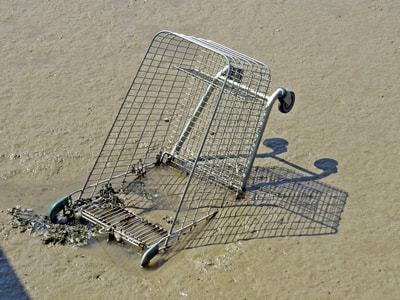 Abandoned shopping trolley in the River Thames in Grays, Essex