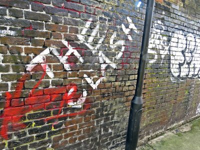 The Clash graffiti in alleyway in East London