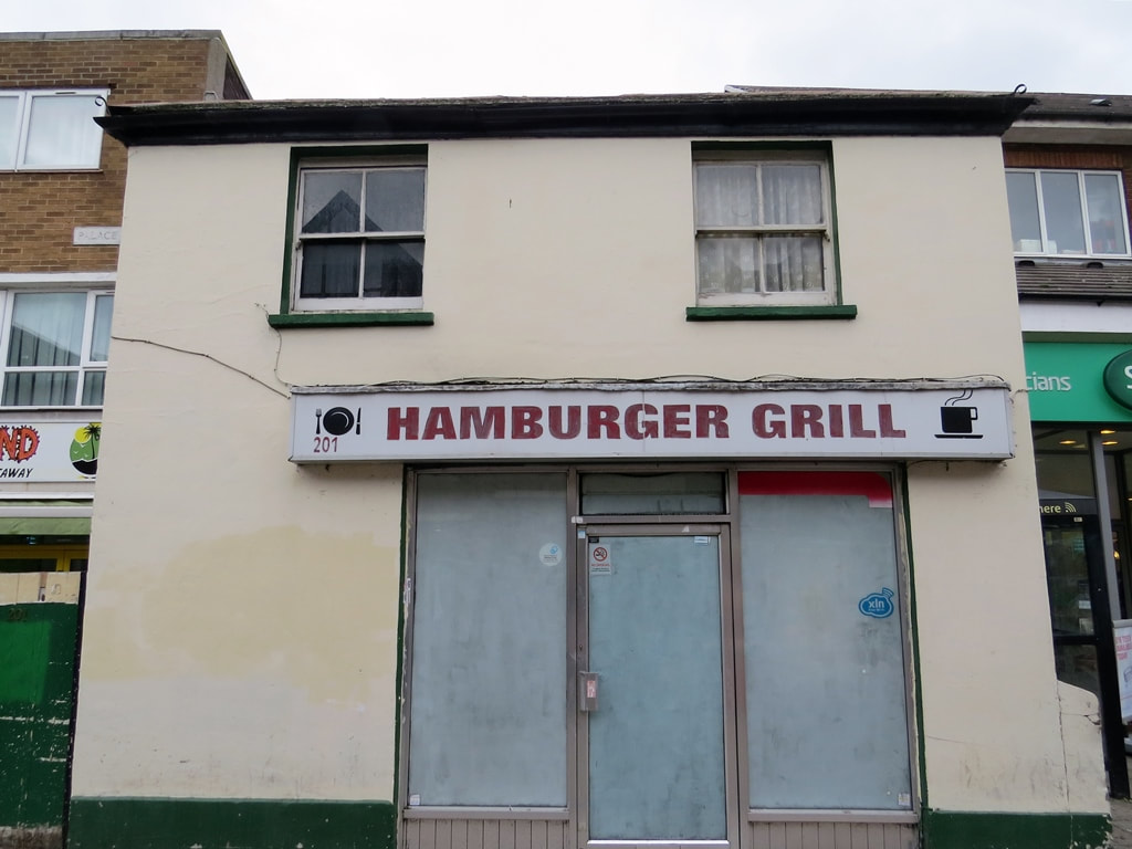 Whitewashed windows of the closed down Hamburger Grill cafe in Walthamstow, E17