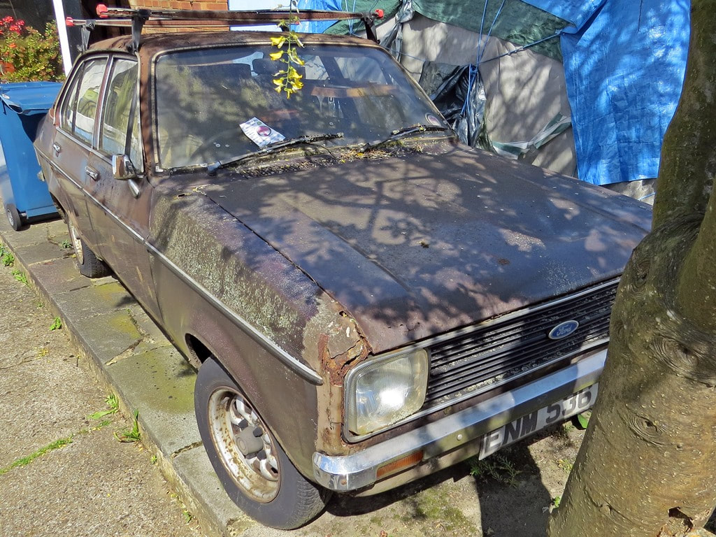 Rusting unloved Ford Escort in Harrow, NW London