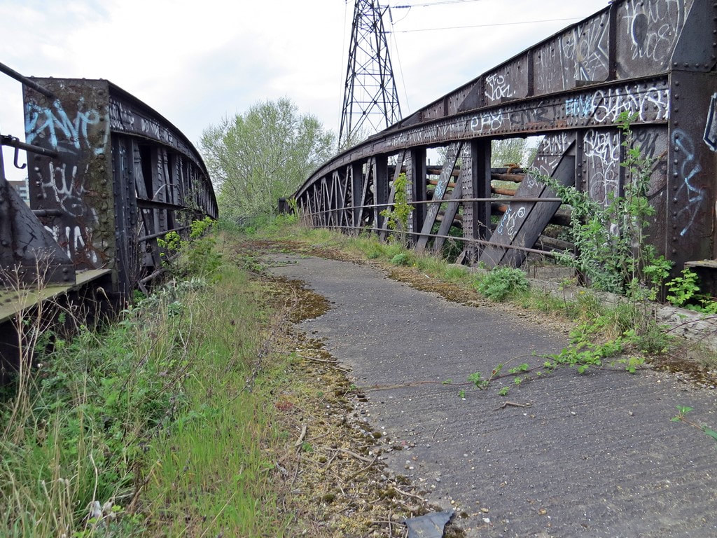 Derelict  bridge that carried sidings across the River Lea that served the former East India Dock warehouses