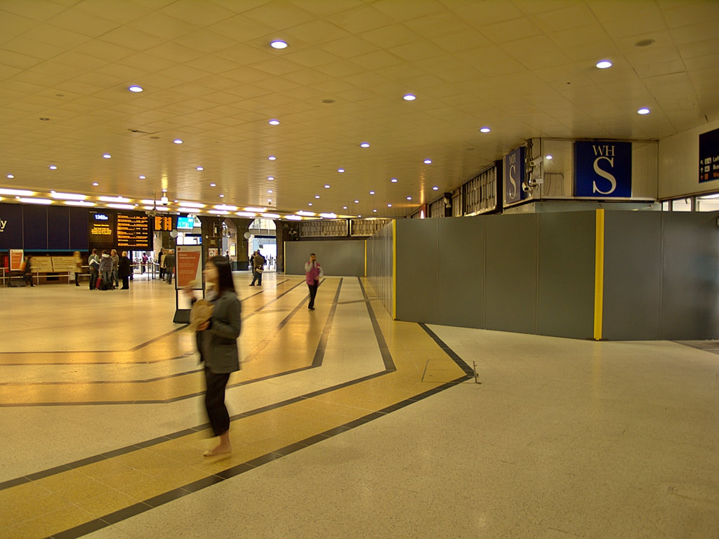 Old concourse and boarded up WH Smith at  Kings Cross Station 