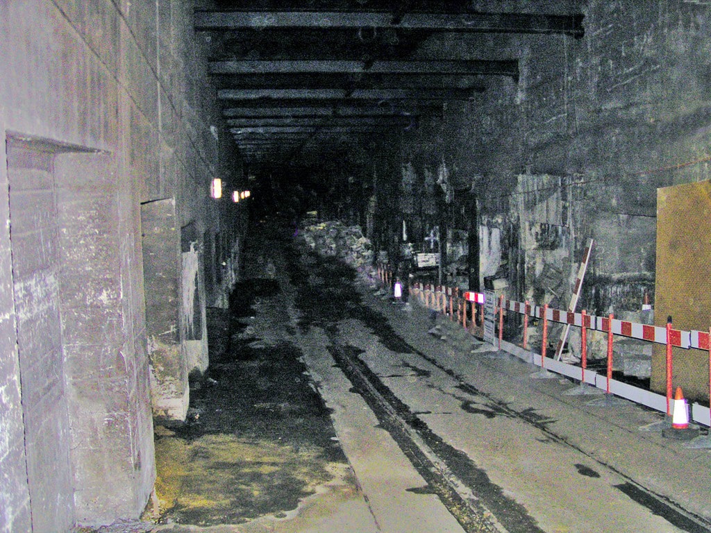 Tram rails in dark tunnel of disused London tunnel