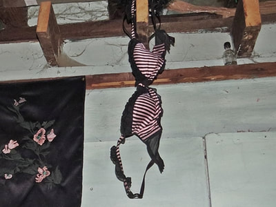 bra hanging in abandoned squat in East London