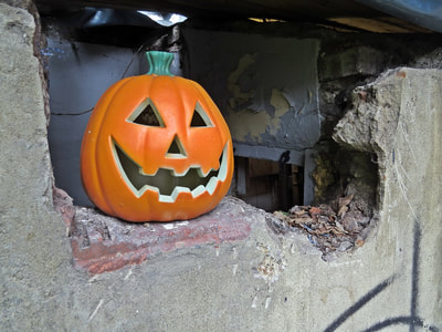 Halloween pumpkin in derelict building in Limehouse, East London