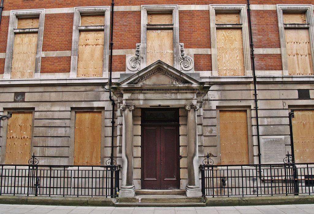 Picture of boarded up and derelict Middlesex Hospital in Central London