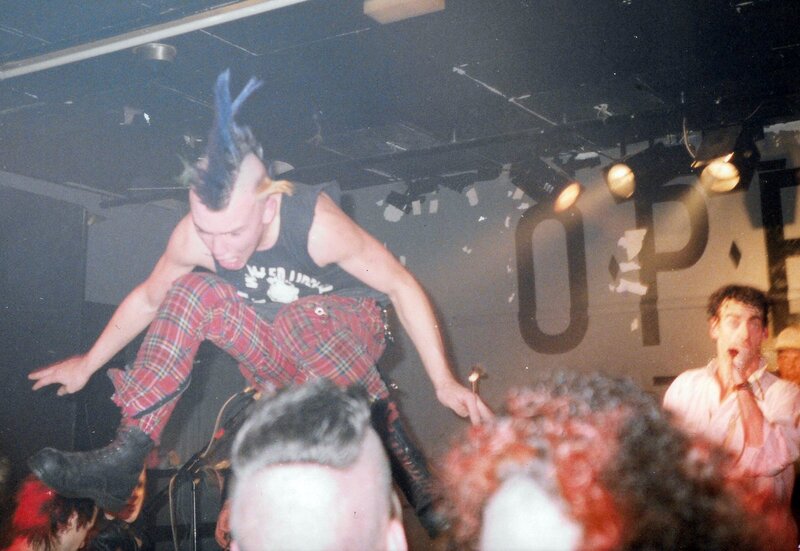 punk rock mohican stage diving at a gig in Shepherds Bush, West London