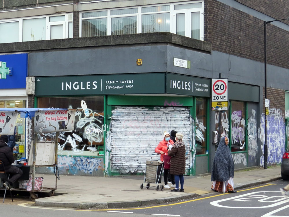Derelict Percy Ingle Bakery shop in Bethnal Green, East London, covered in graffiti.  