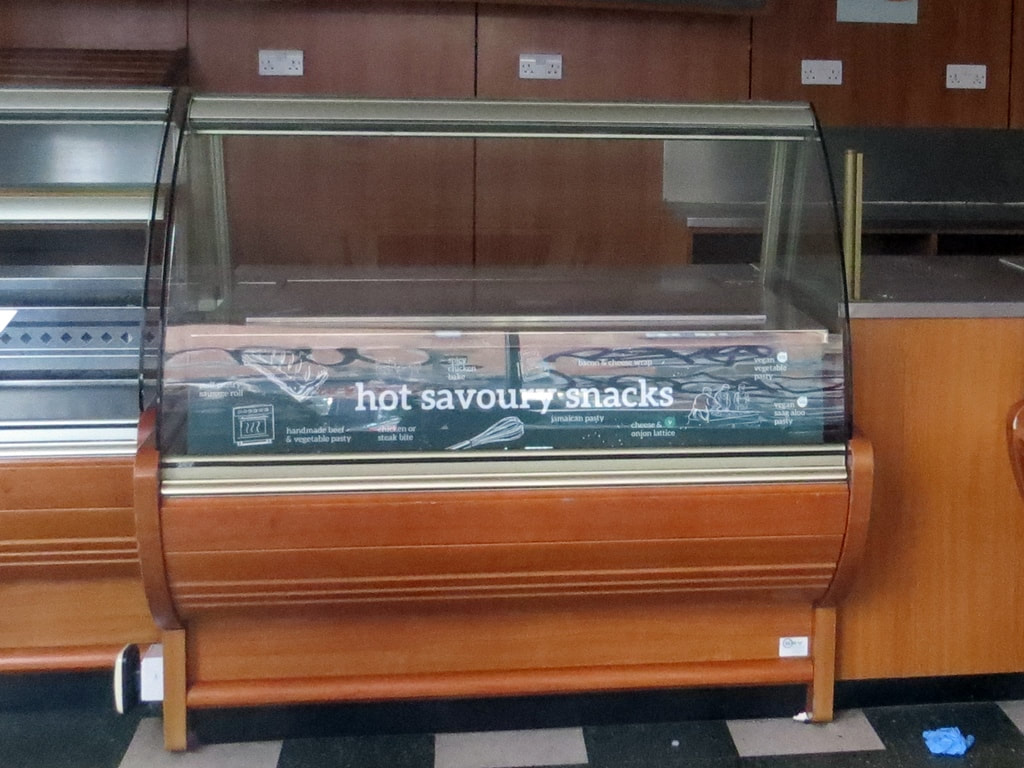 Interior of hot savoury snack counter at Percy Ingle Bakery shop in East London after closure