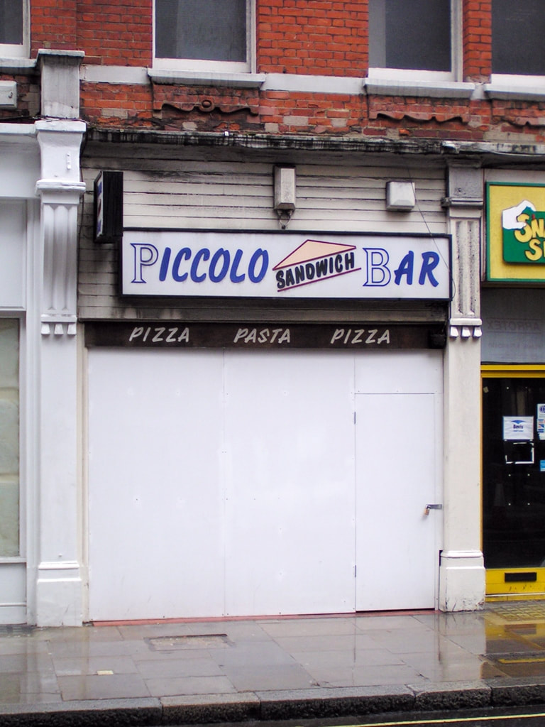 Picture of boarded up Piccolo sandwich bar in the City of London on Eldon Street