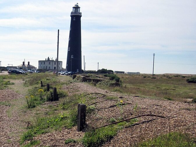 Picture of Remains of derelict Dungeness Railway Station platform closed in 1937 with lighthouse in background