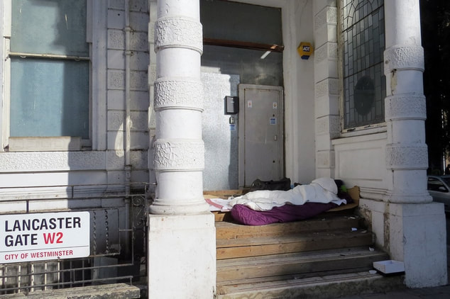 Picture of homeless person in doorway of derelict Averard Hotel in Bayswater, SW1