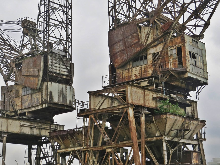 Derelict London Battersea Power Station - The jetty facilities used these two cranes to offload coal, with the capacity of unloading two ships at one time
