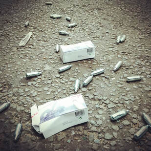 Discarded laughing gas bottles in London 