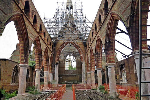 Interior of the abandoned burnt out shell of Saint Saviour's Church in Bartlett Park in Poplar, East London