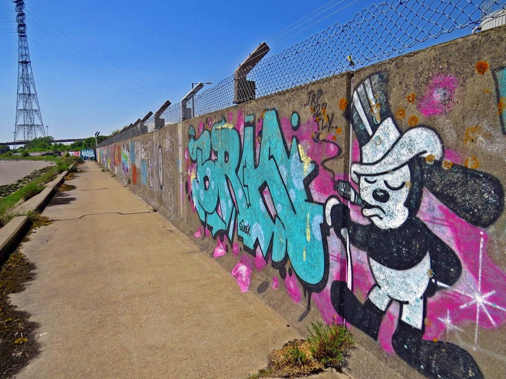 Along the river path there is a 1.6 mile long concrete flood defence wall often regarded by many as a 'legal graffiti' wall. 