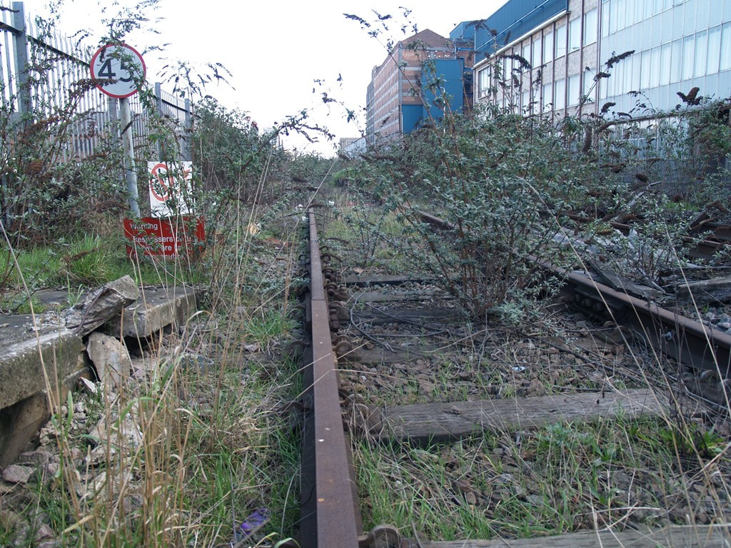 Desolate overgrown railway line in Silvertown, East  London