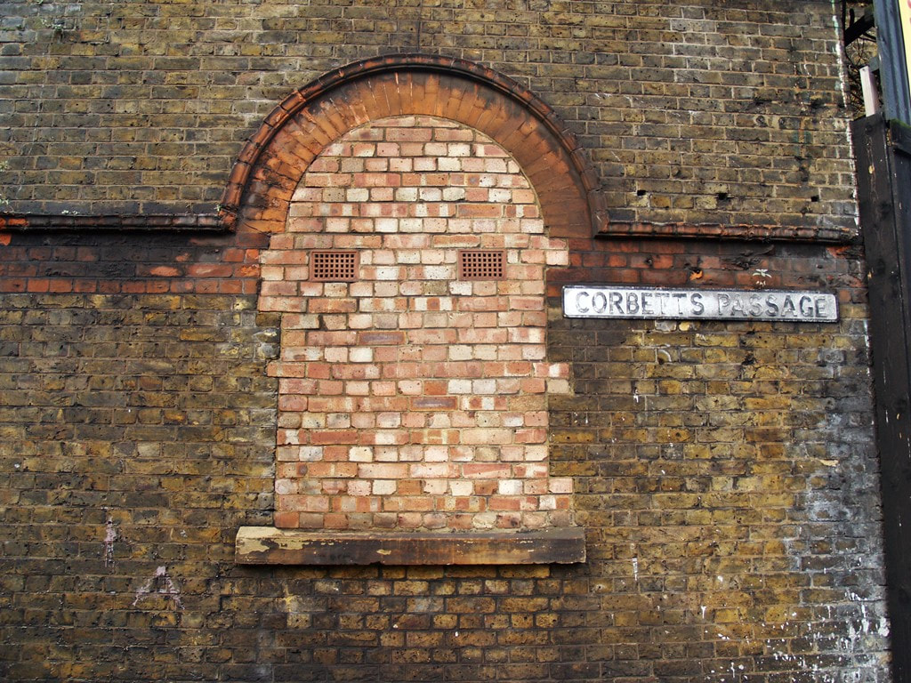 Corbetts Passage and bricked up window to abandoned South London railway station