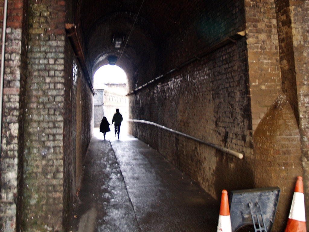 Narrow passage under railway arch on Southwark Park Road