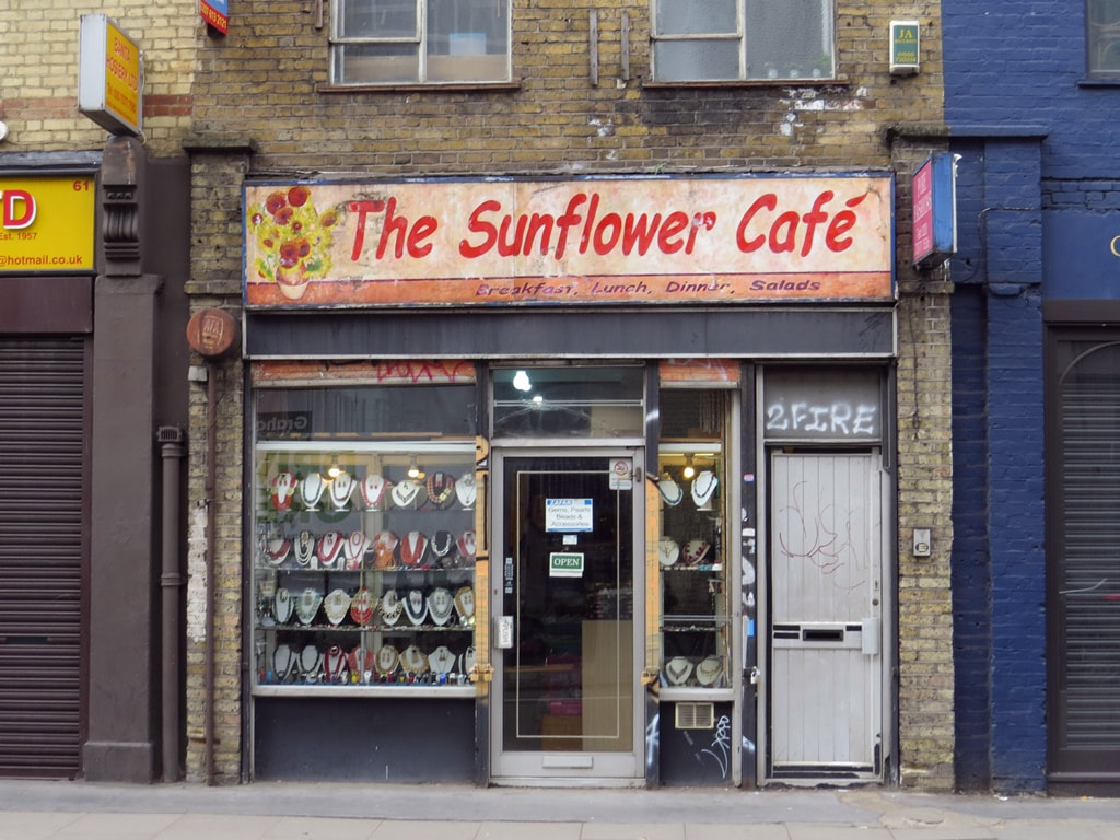 The Sunflower Café signage above a shop now selling Asian jewellery in Commercial Street, Spitalfields,E1