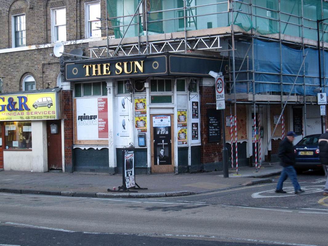 closed down and boarded up Sun Tavern on the Bethnal Green Road