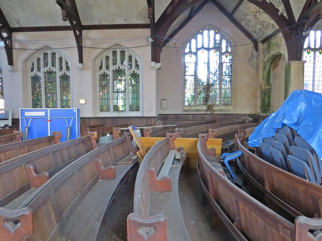Dusty pews in vacant church in South London