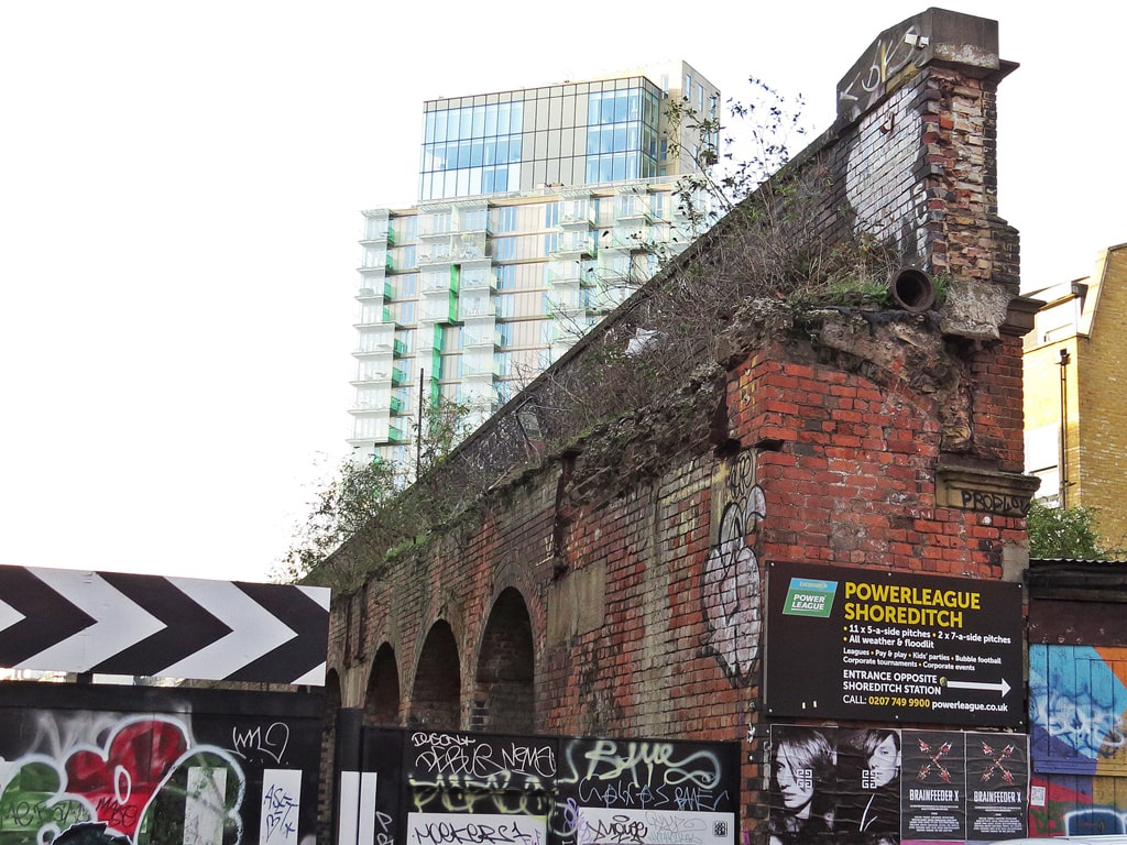 Remains of crumbling brick walls of Bishopsgate Goodsyard in Brick Lane, East London.