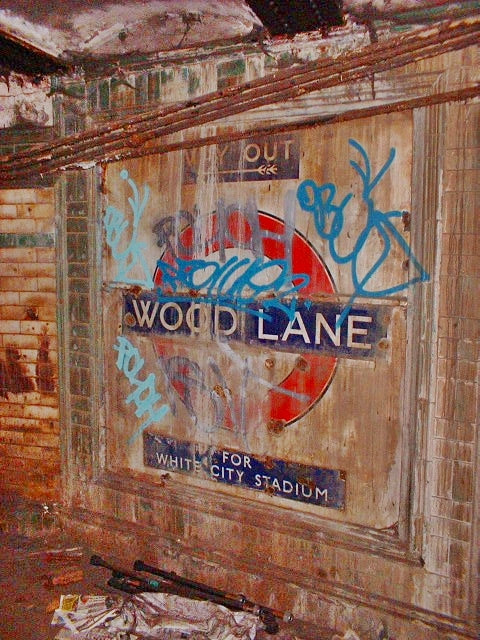 Graffiti covered roundel for disused Wood Lane ghost tube station 