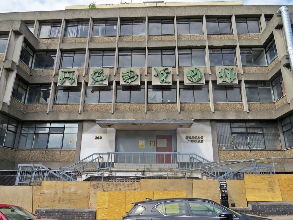 Signs of the Zodiac on abandoned Brutalist South London concrete building in Croydon
